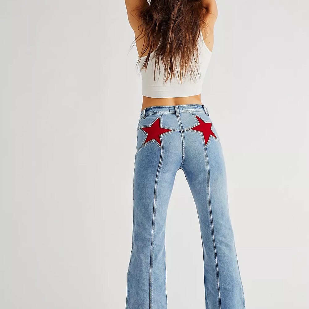 We The Free Blue Flare Jeans with Red Star Accents